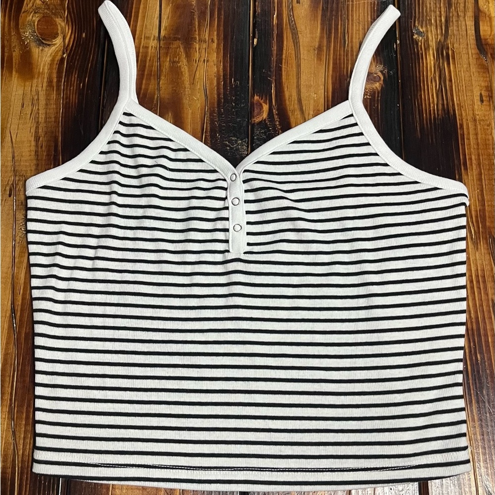 Soft cropped white tank top with black stripes.